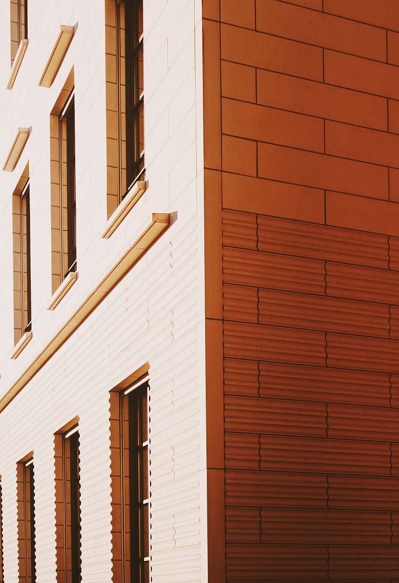window brown building with glass windows curtain